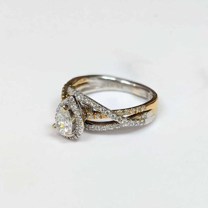 0.87 CT.T.W Framed Pear-cut Diamond Engagement Ring in 14k Two Toned Gold with Twist Shank
