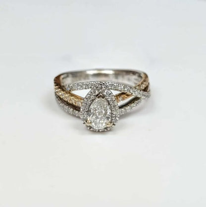 0.87 CT.T.W Framed Pear-cut Diamond Engagement Ring in 14k Two Toned Gold with Twist Shank