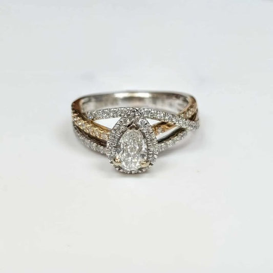 0.87 CT.T.W Framed Pear-cut Diamond Engagement Ring in 14k Two Toned Gold with Twist Shank