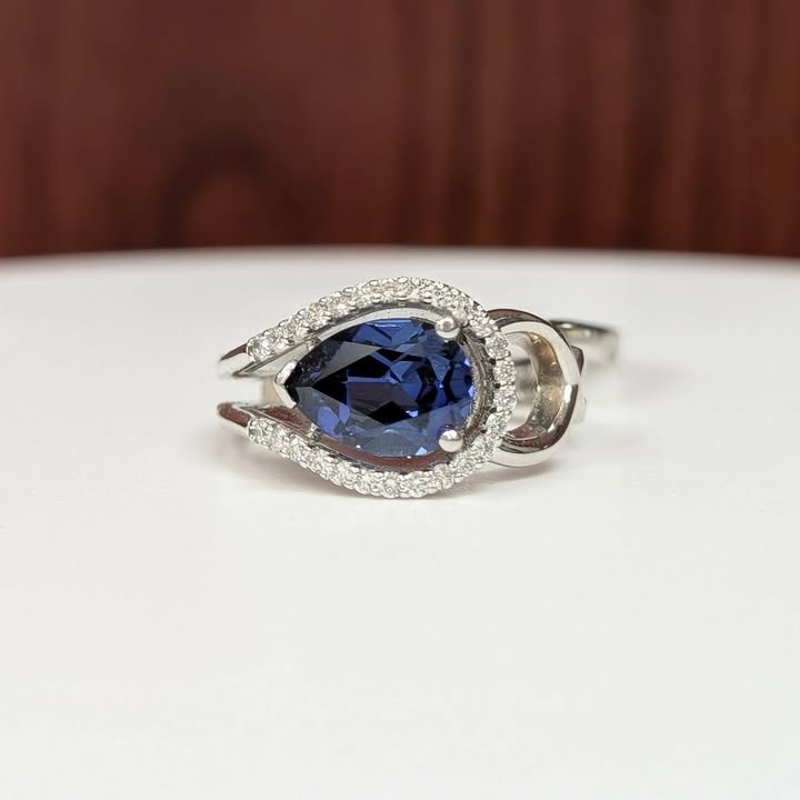 East West Set Pear-cut Blue Sapphire Ring with Sweeping Diamond Frame in 14k White Gold