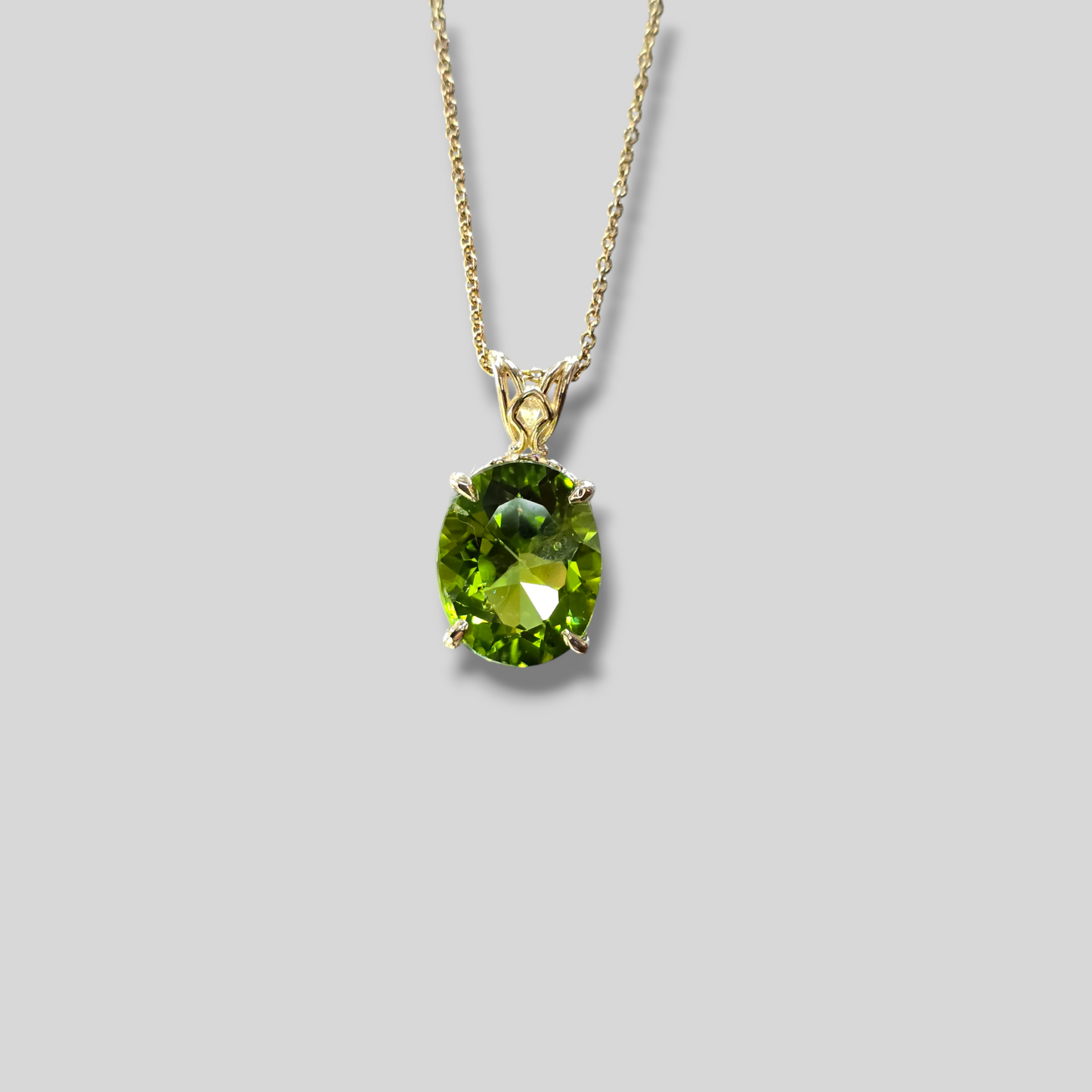 Oval Peridot Solitaire Pendant